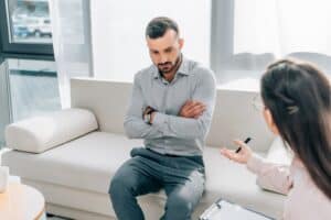 psychologist and patient talking in clinic mental health concept