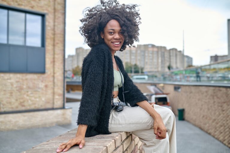 happy young woman on a urban backgraound